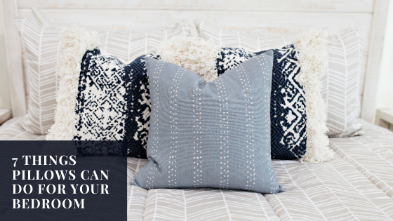 
      An assortment of throw pillows on a bed
    