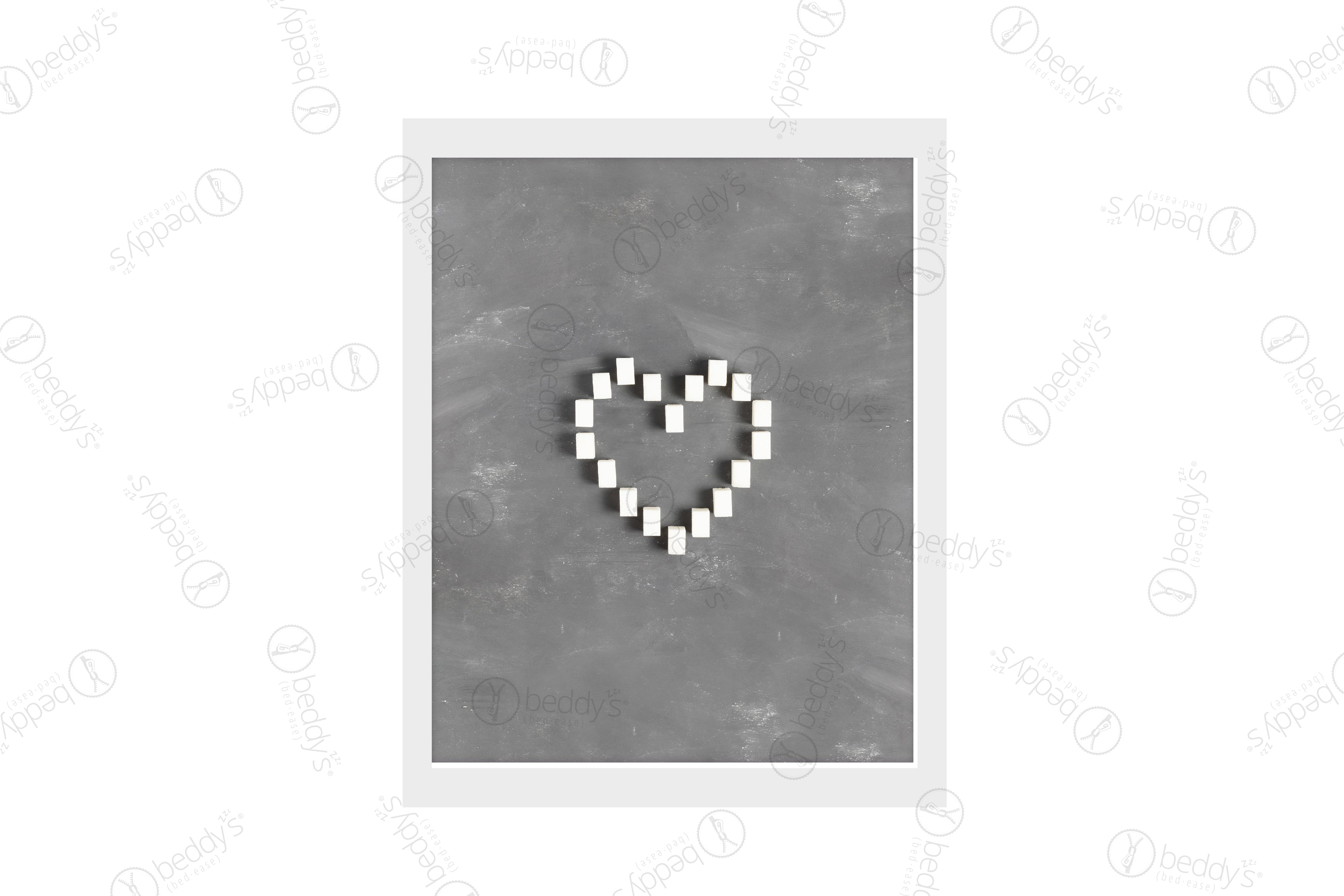 Multiple white sugar cubes making a heart with a gray background digital artwork showcased in a frame.